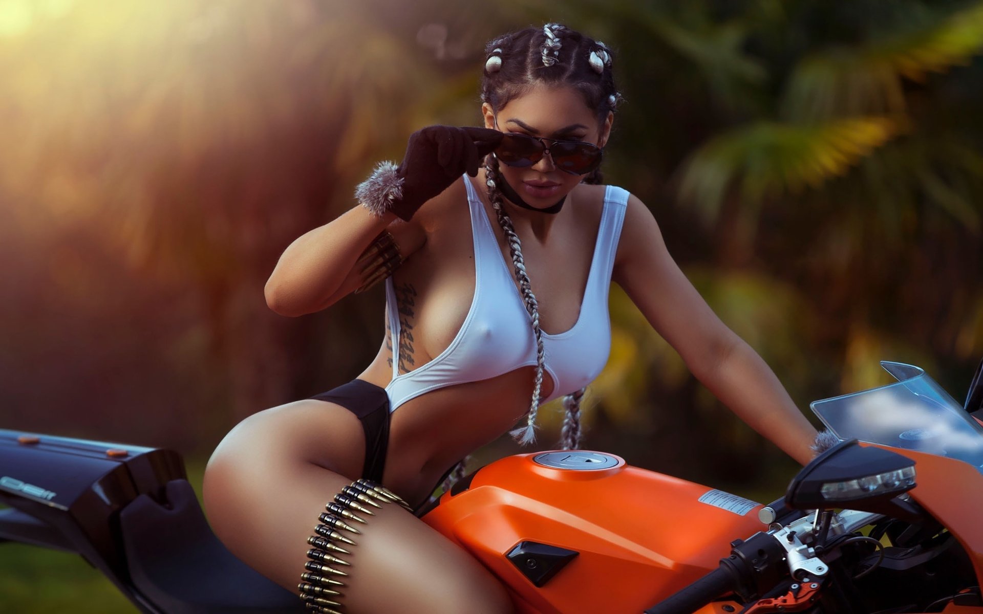 Girls with tattoos and motorcycles in Cotonou